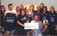 WBRC Celtic Challenge team 2014 presenting a cheque for £1927.00 to the RNLI